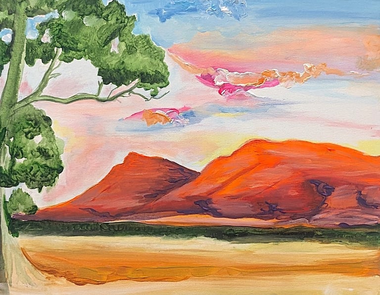 Watercolor painting of a desert landscape with red rock formations, green tree on left, sandy terrain, and pink sky
